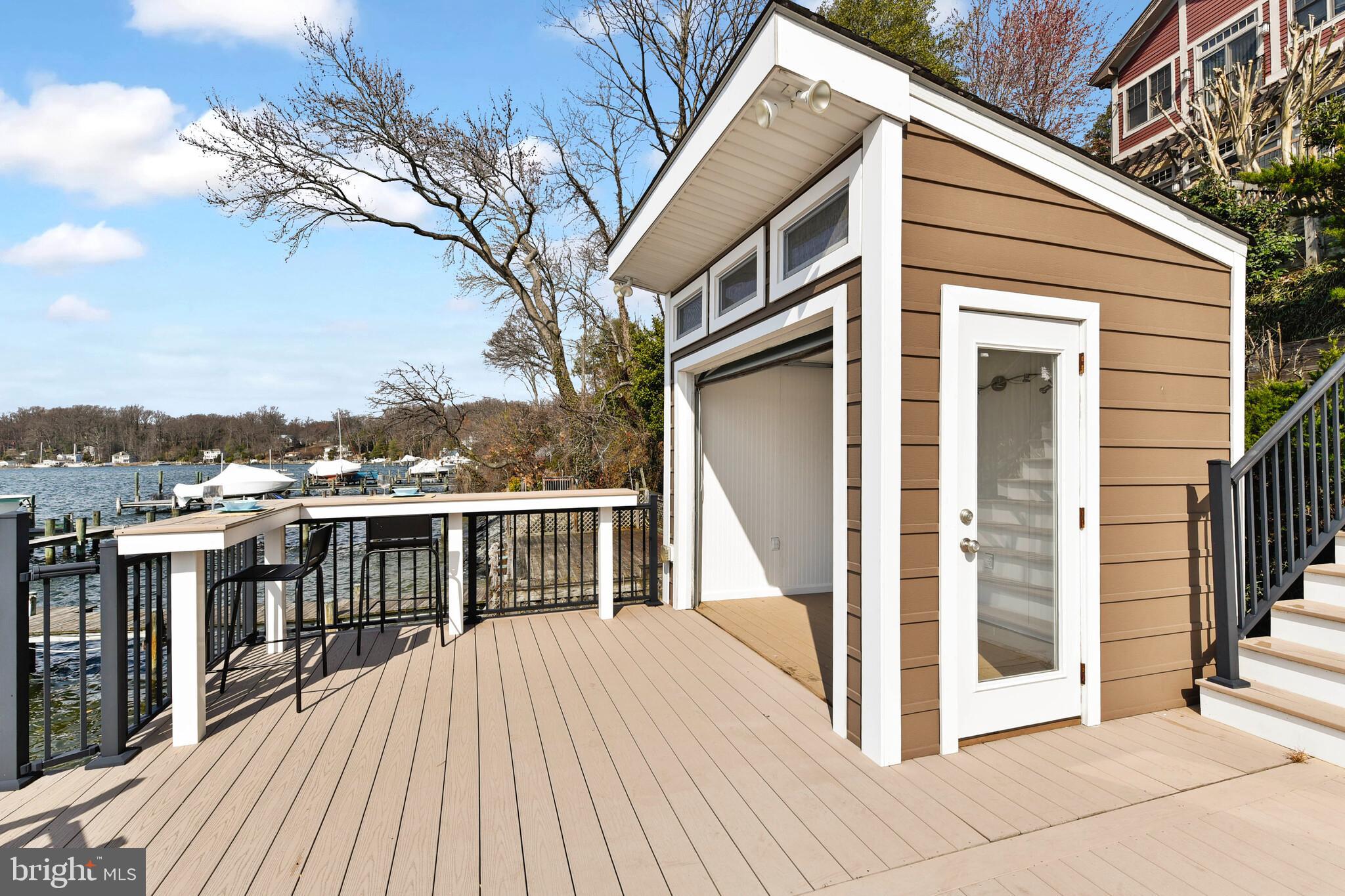 245 Long Point Road Crownsville, MD 21032 - Photo 8 of 53 a balcony with wooden floor and fence