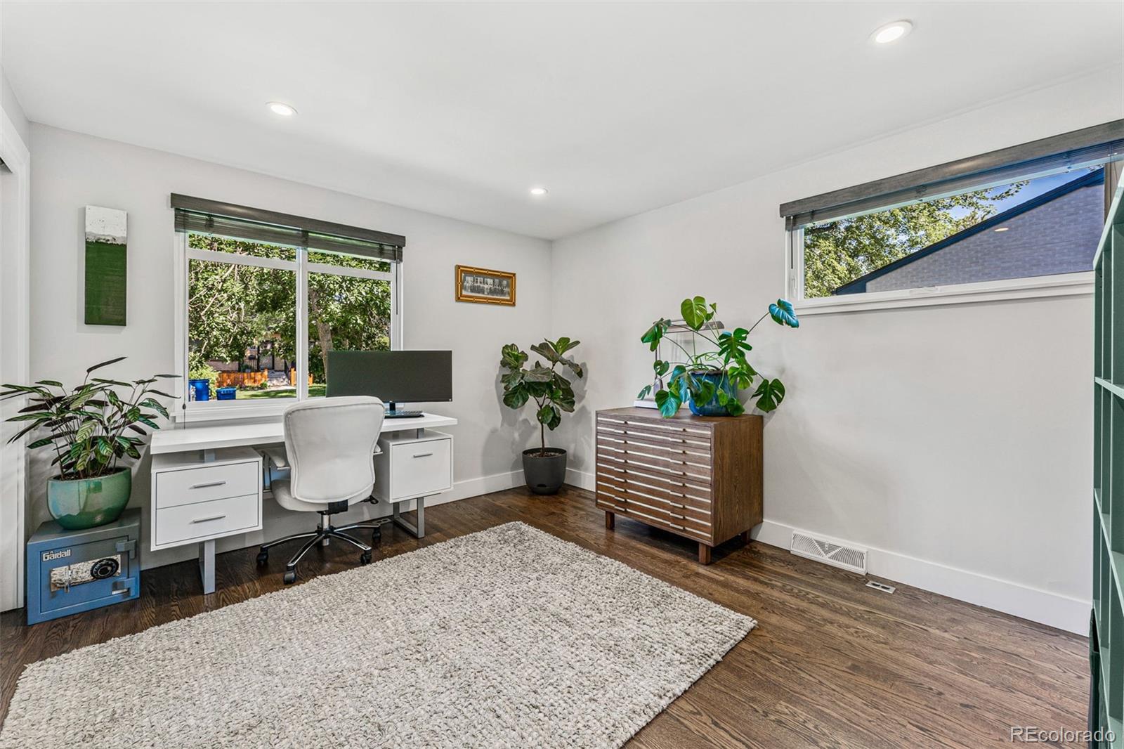 3885 Cody Street Wheat Ridge, CO 80033 - Photo 24 of 40 a living room with furniture and a potted plant