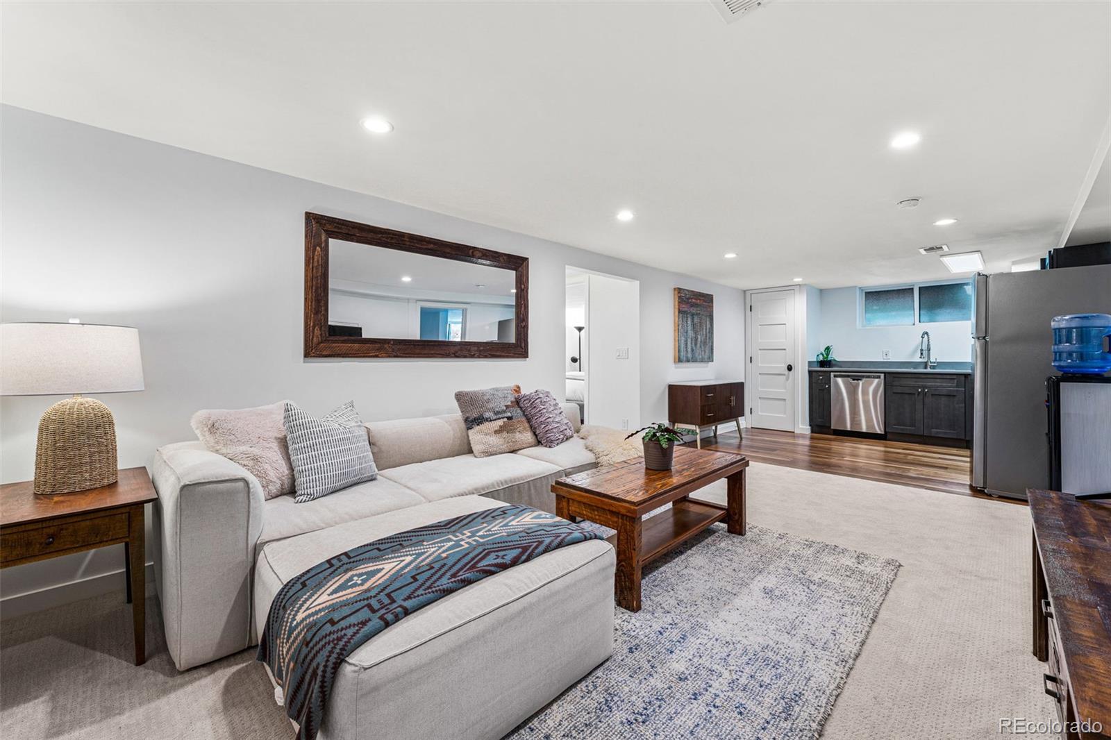 3885 Cody Street Wheat Ridge, CO 80033 - Photo 27 of 40 a living room with furniture and a couch