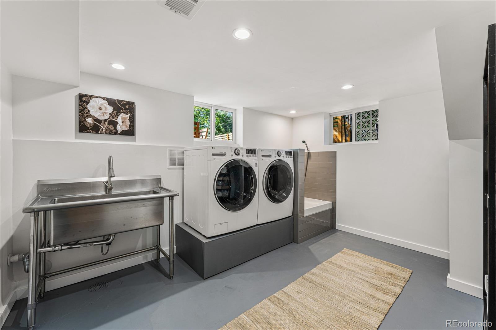 3885 Cody Street Wheat Ridge, CO 80033 - Photo 33 of 40 a utility room with washer and dryer