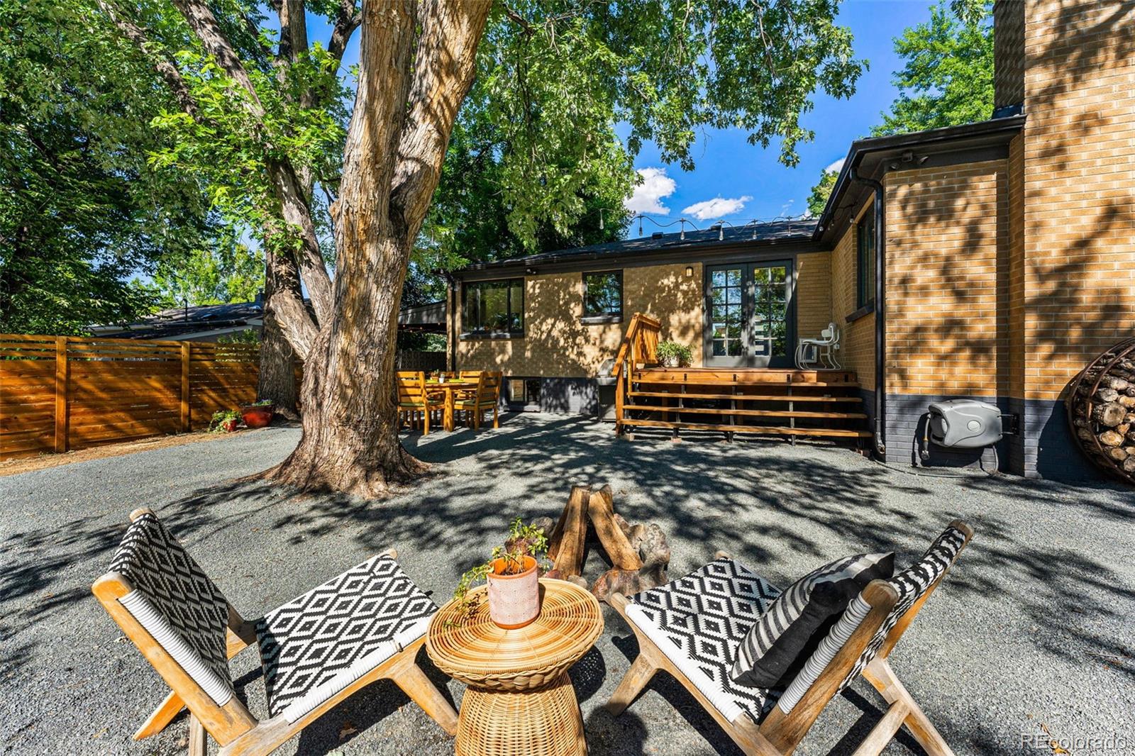 3885 Cody Street Wheat Ridge, CO 80033 - Photo 37 of 40 a view of a chairs and table on the wooden floor
