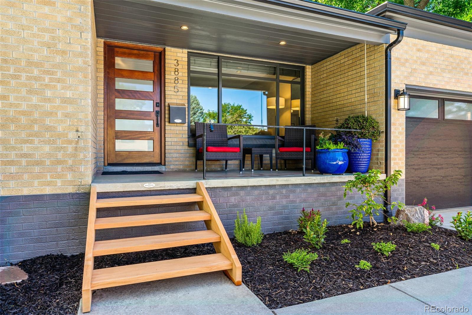 3885 Cody Street Wheat Ridge, CO 80033 - Photo 4 of 40 a front view of a house with a porch