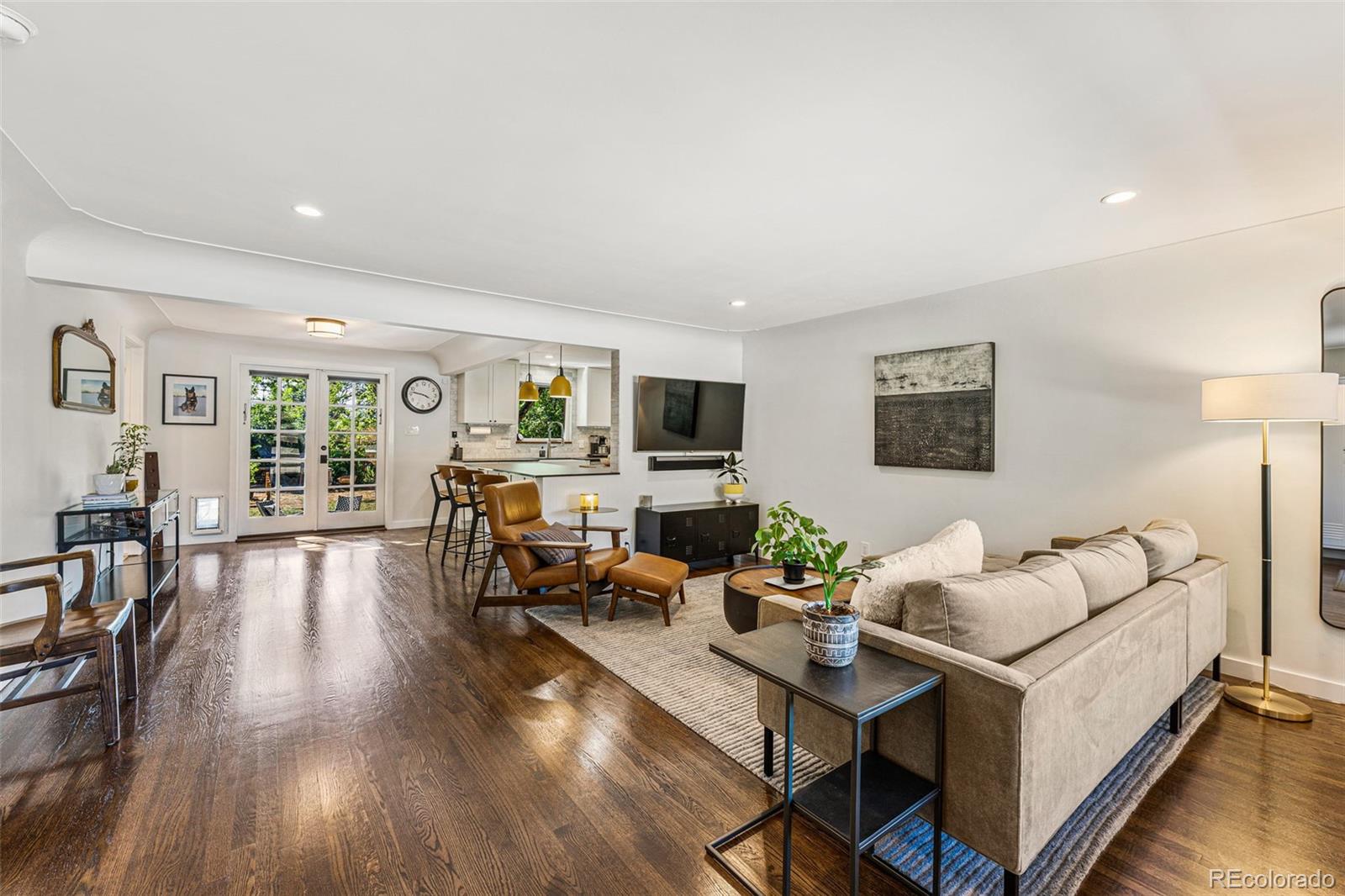 3885 Cody Street Wheat Ridge, CO 80033 - Photo 5 of 40 a living room with furniture and wooden floor