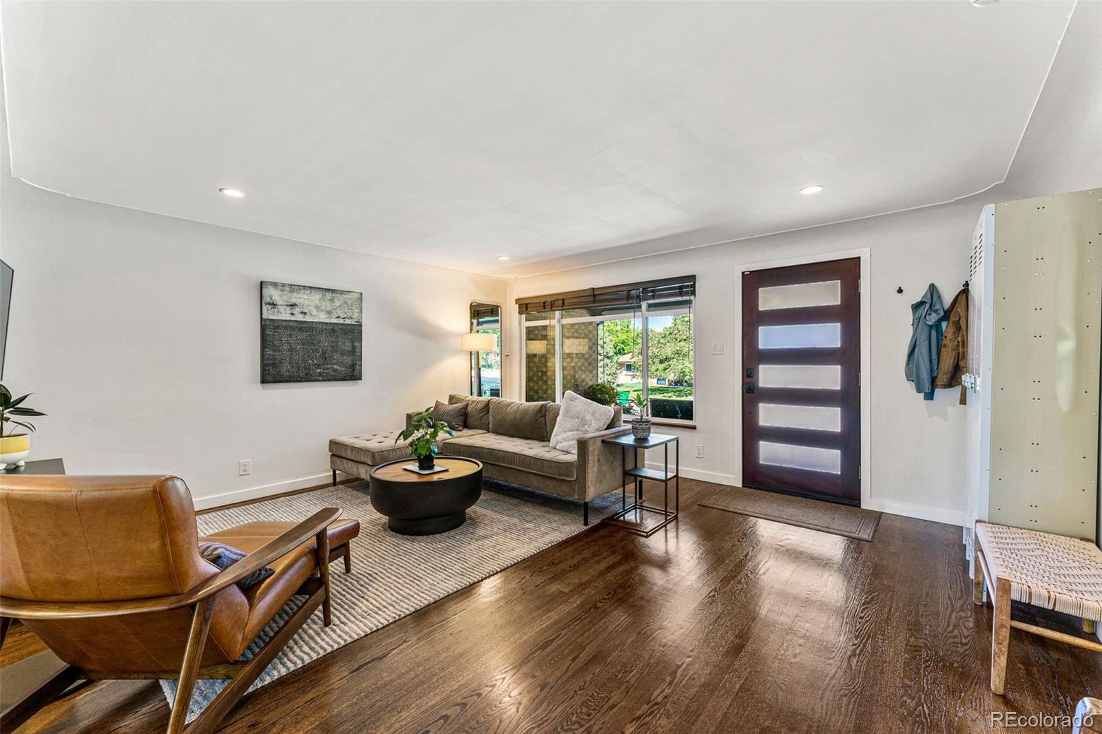 3885 Cody Street Wheat Ridge, CO 80033 - Photo 8 of 40 a living room with furniture and wooden floor