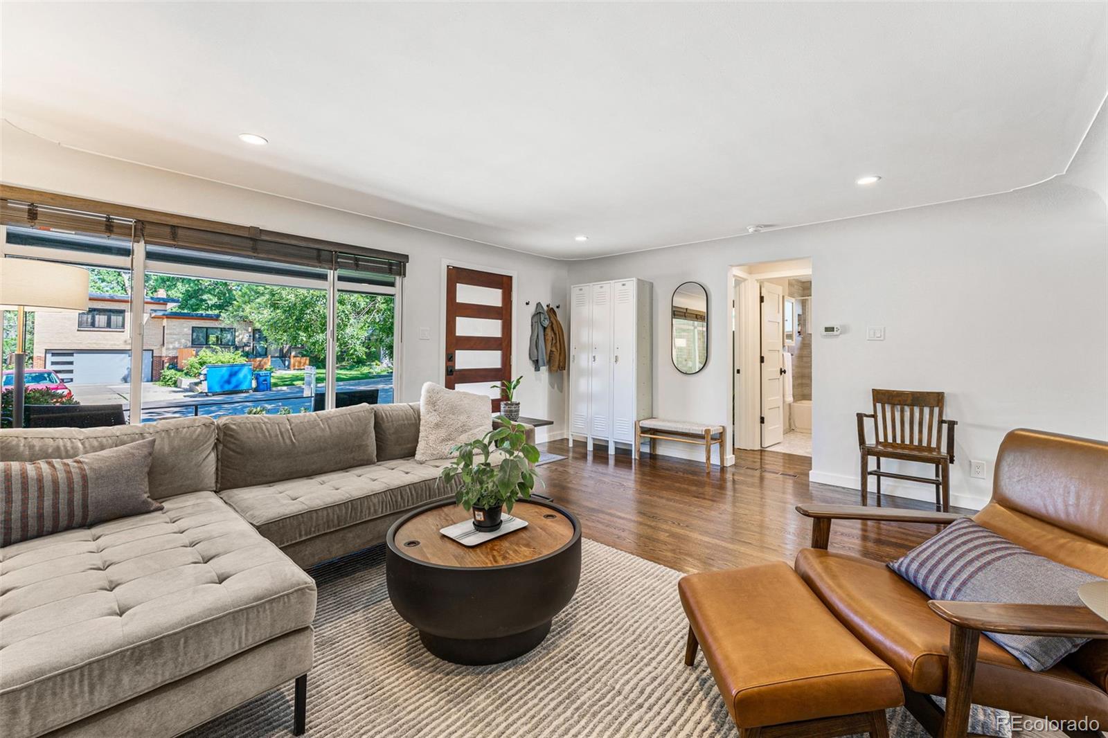 3885 Cody Street Wheat Ridge, CO 80033 - Photo 9 of 40 a living room with furniture and a large window