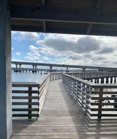 a view of swimming pool with furniture
