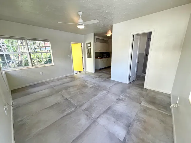 a view of an empty room with a window