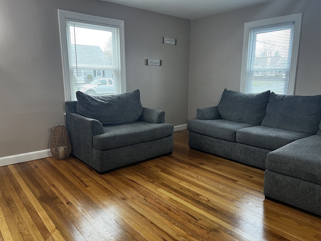 133 Winton Street Springfield, MA 01118 - Photo 3 of 17 a living room with furniture and a window