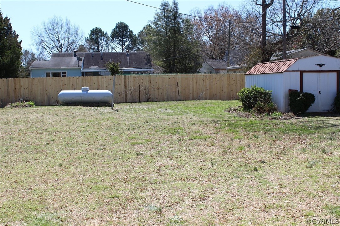 2711 Elora Road Richmond, VA 23223 - Photo 20 of 24 Large fenced backyard with storage shed.