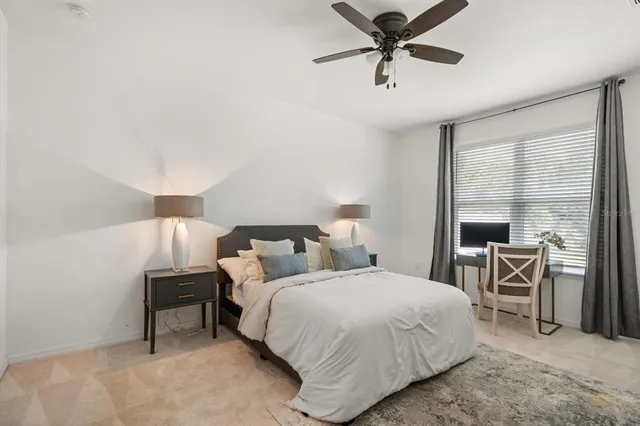 a bedroom with bed and a table