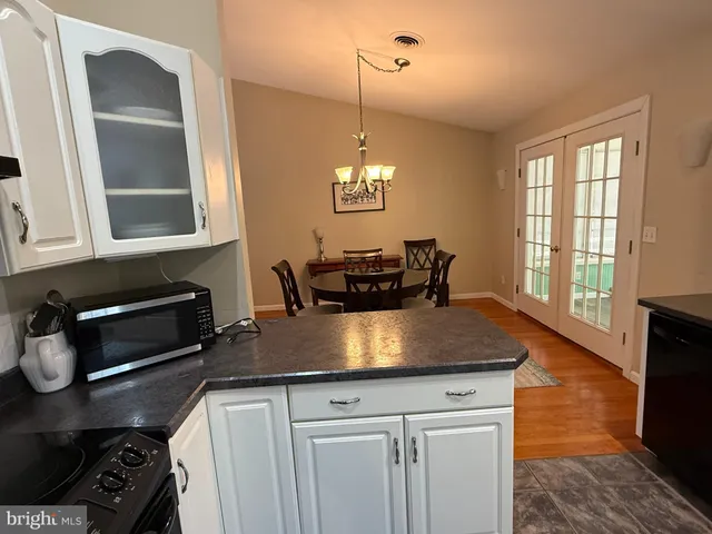 a kitchen with a stove and a refrigerator