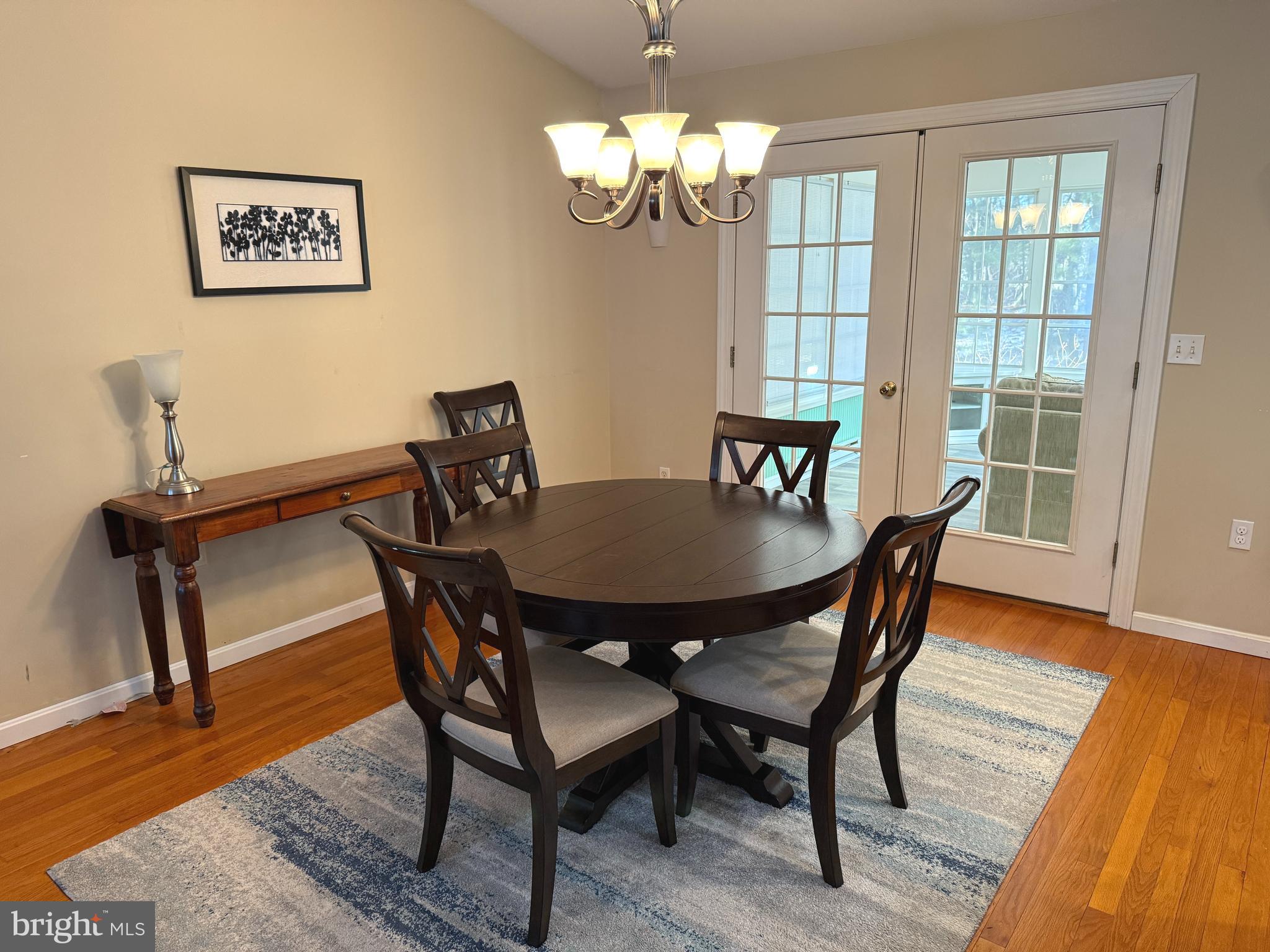 32651 East Riga Drive Ocean View, DE 19970 - Photo 5 of 36 Dinng room opens to sunroom