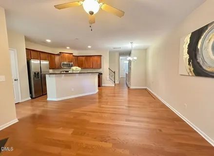 a view of a kitchen with a sink and a refrigerator