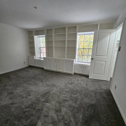 an empty room with windows