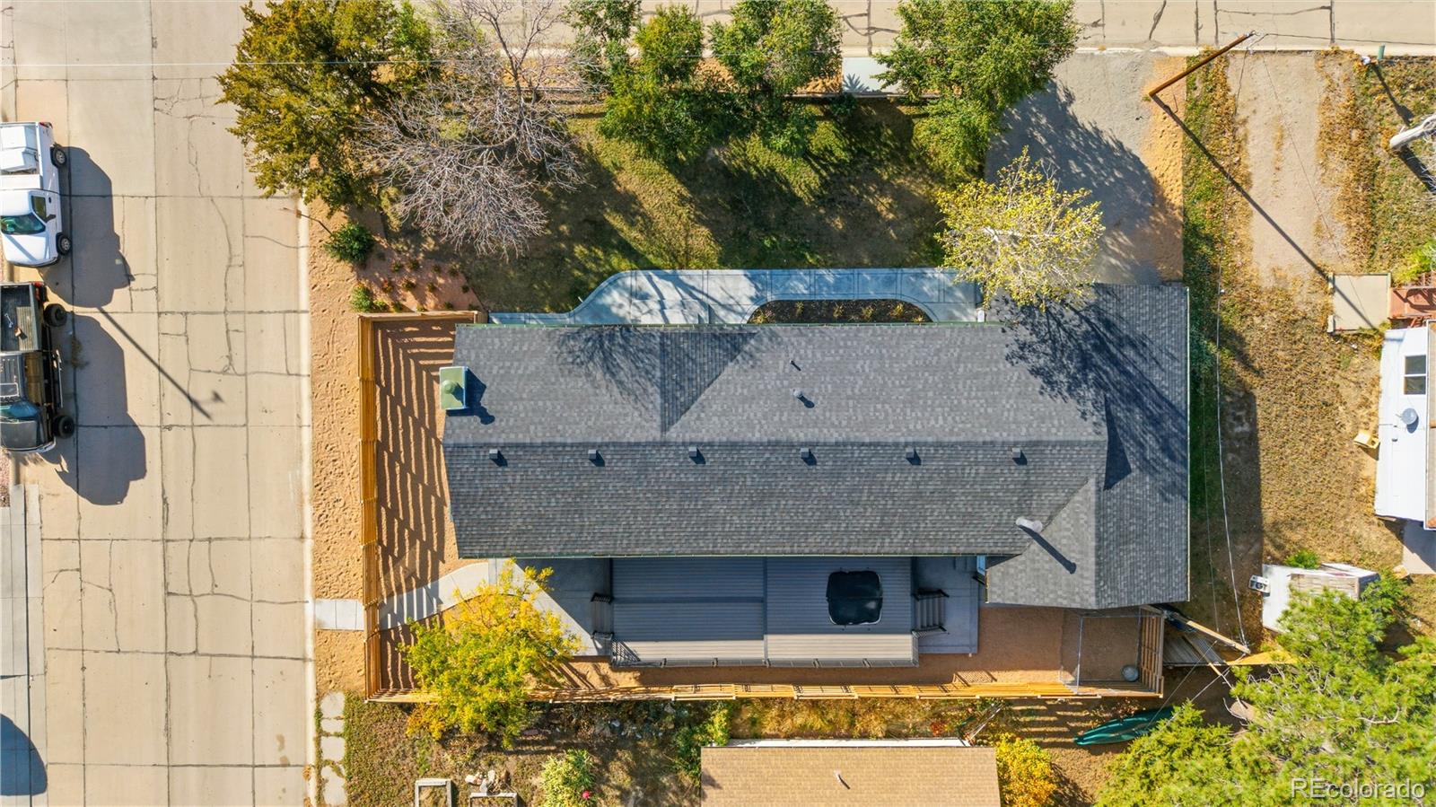 610 6th Street Bennett, CO 80102 - Photo 12 of 34 a front view of a house with a garden