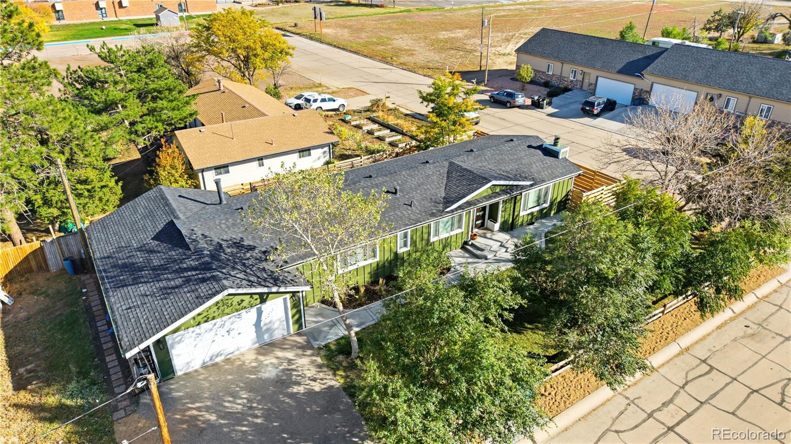 610 6th Street Bennett, CO 80102 - Photo 15 of 34 an aerial view of multiple houses with yard