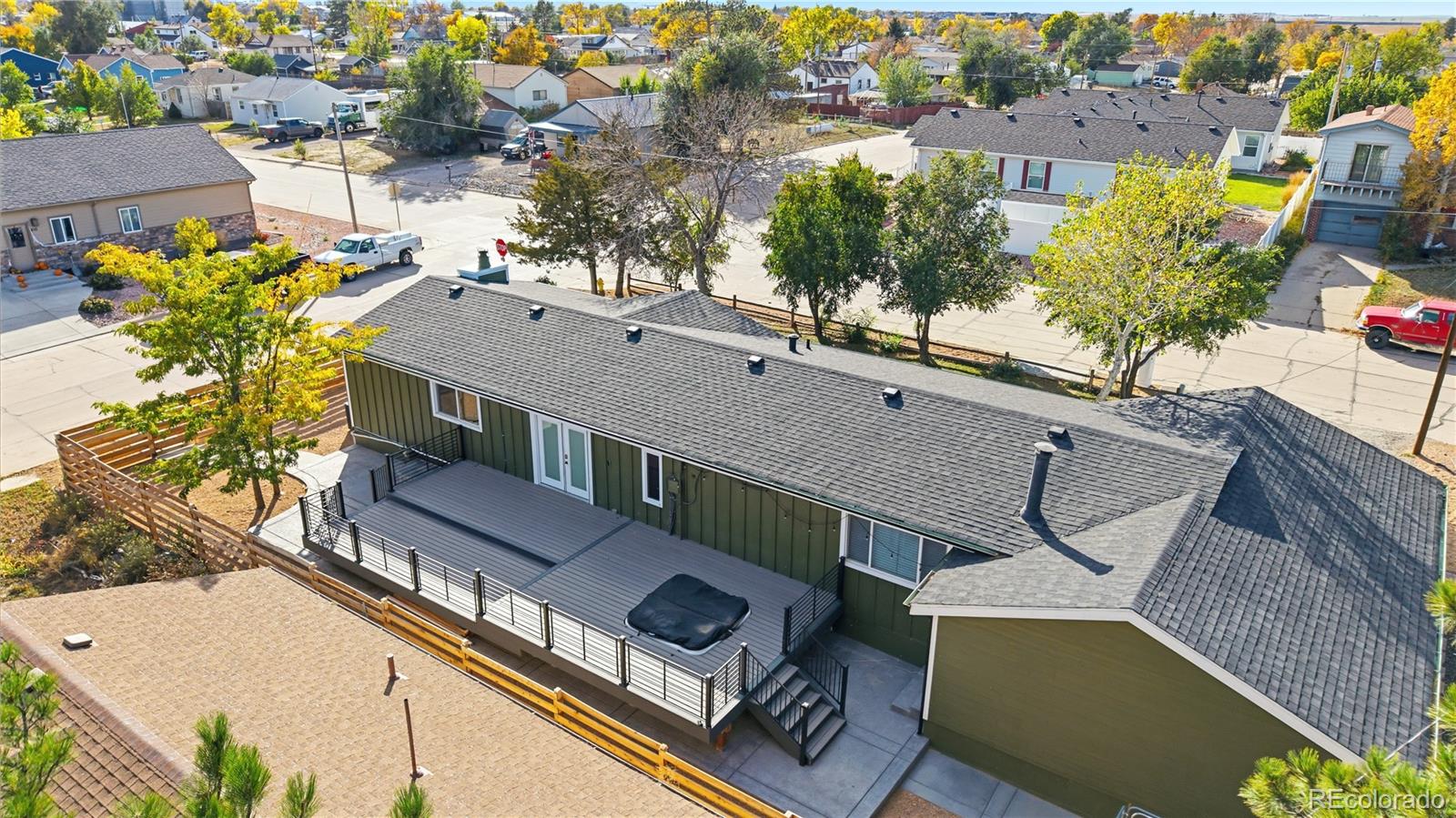 610 6th Street Bennett, CO 80102 - Photo 24 of 34 a view of a house with pool and lawn chairs