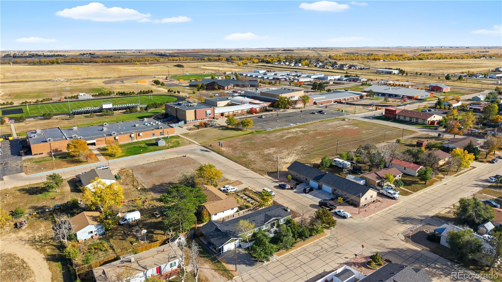 610 6th Street Bennett, CO 80102 - Photo 10 of 34 an aerial view of residential houses with outdoor space