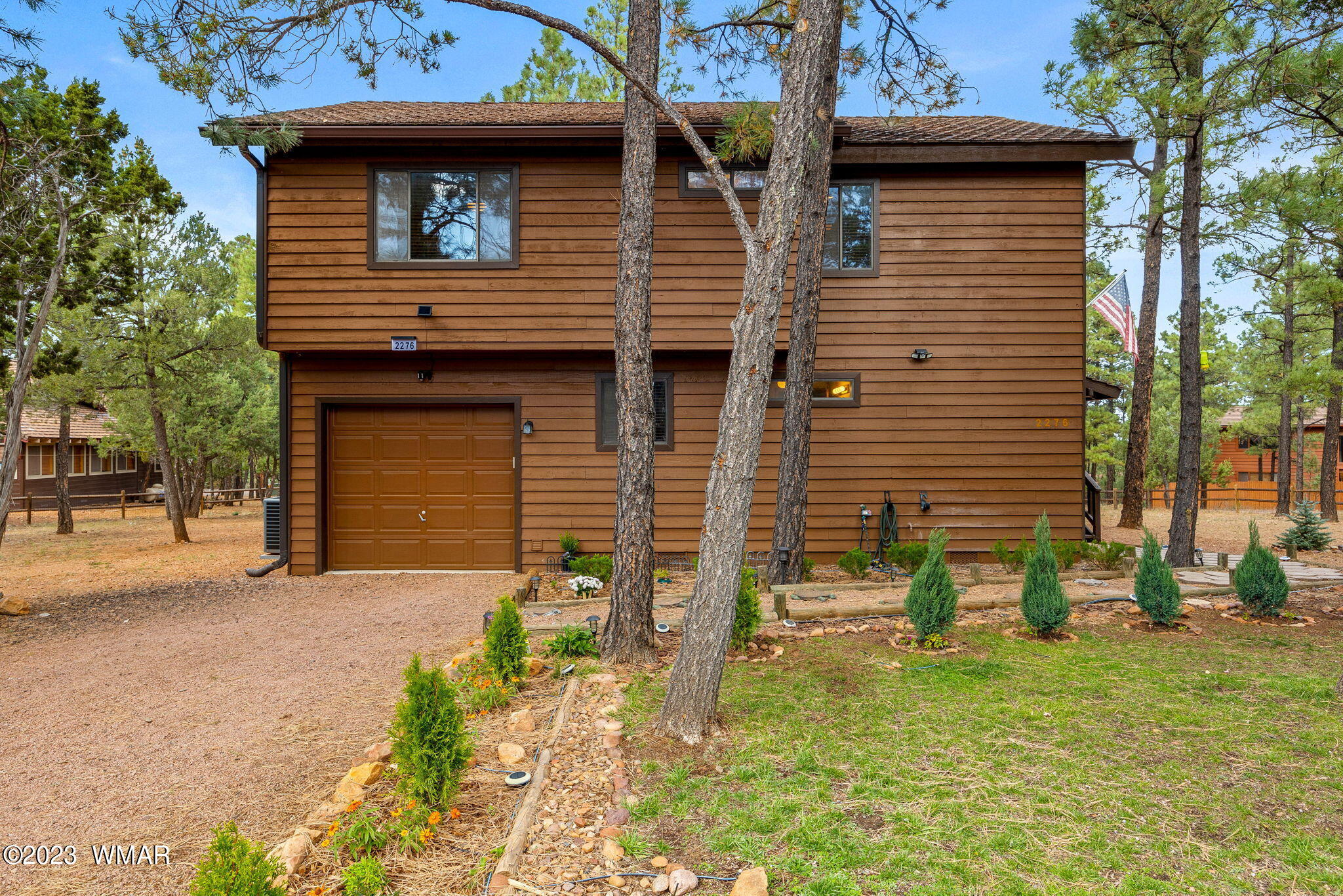 2276 Lindberg Road Overgaard, AZ 85933 - Photo 1 of 34 a front view of a house with garden