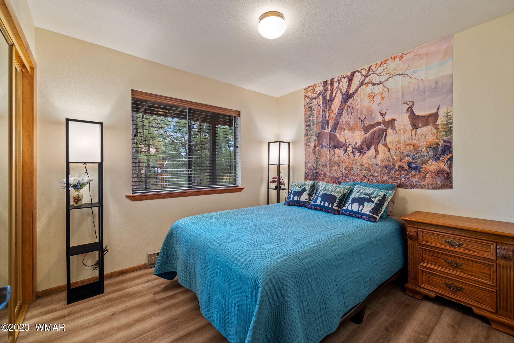 2276 Lindberg Road Overgaard, AZ 85933 - Photo 14 of 34 a bedroom with a bed and a window