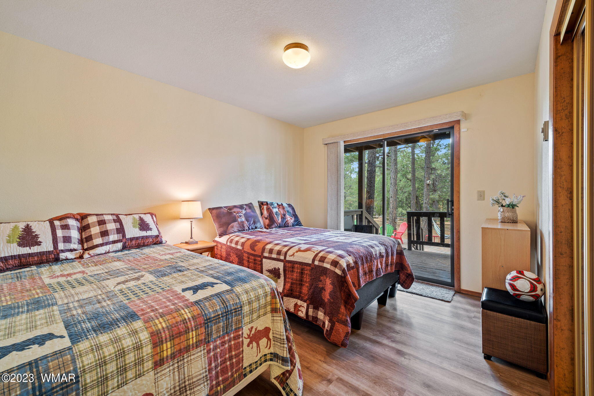 2276 Lindberg Road Overgaard, AZ 85933 - Photo 16 of 34 a bedroom with two beds and a potted plant