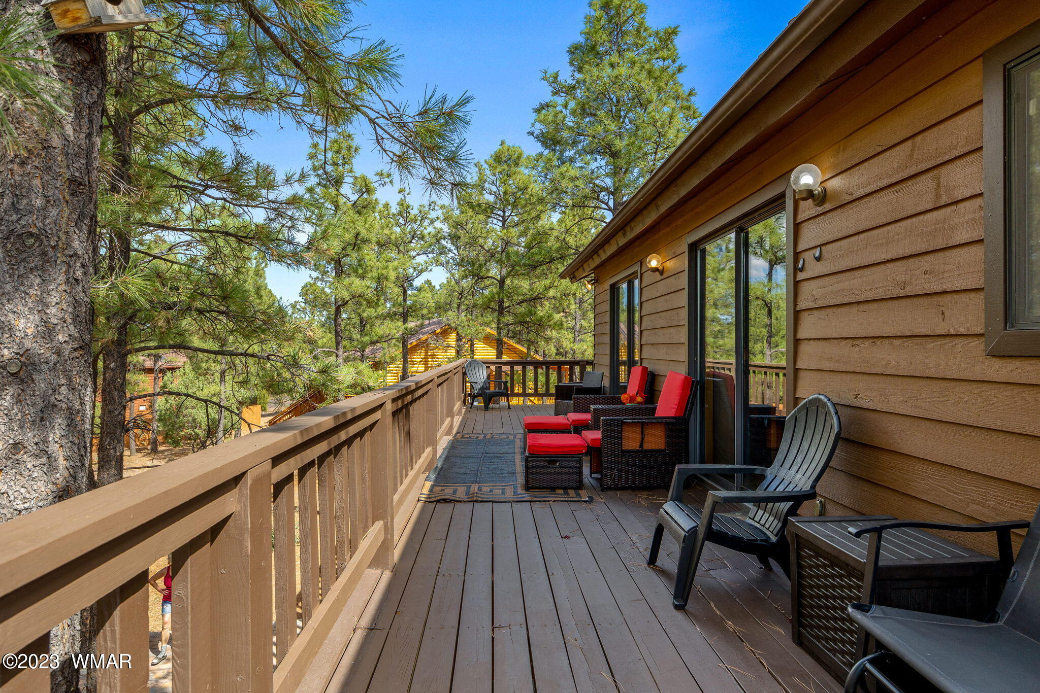 2276 Lindberg Road Overgaard, AZ 85933 - Photo 27 of 34 a view of deck with table and chairs and wooden floor