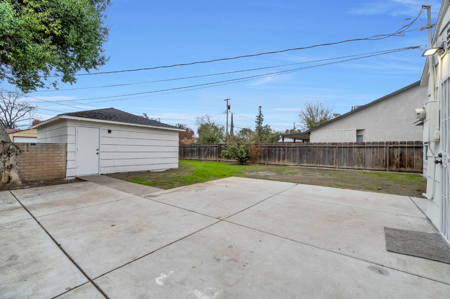 1503 North Pacific Avenue Fresno, CA 93728 - Photo 23 of 26 a view of backyard of house and car parked