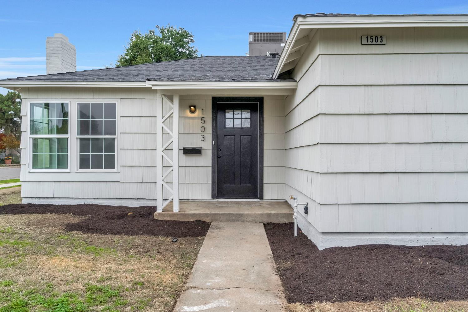 1503 North Pacific Avenue Fresno, CA 93728 - Photo 4 of 26 a house with white door