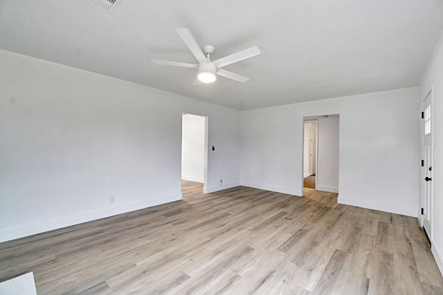 1503 North Pacific Avenue Fresno, CA 93728 - Photo 7 of 26 a view of an empty room and wooden floor