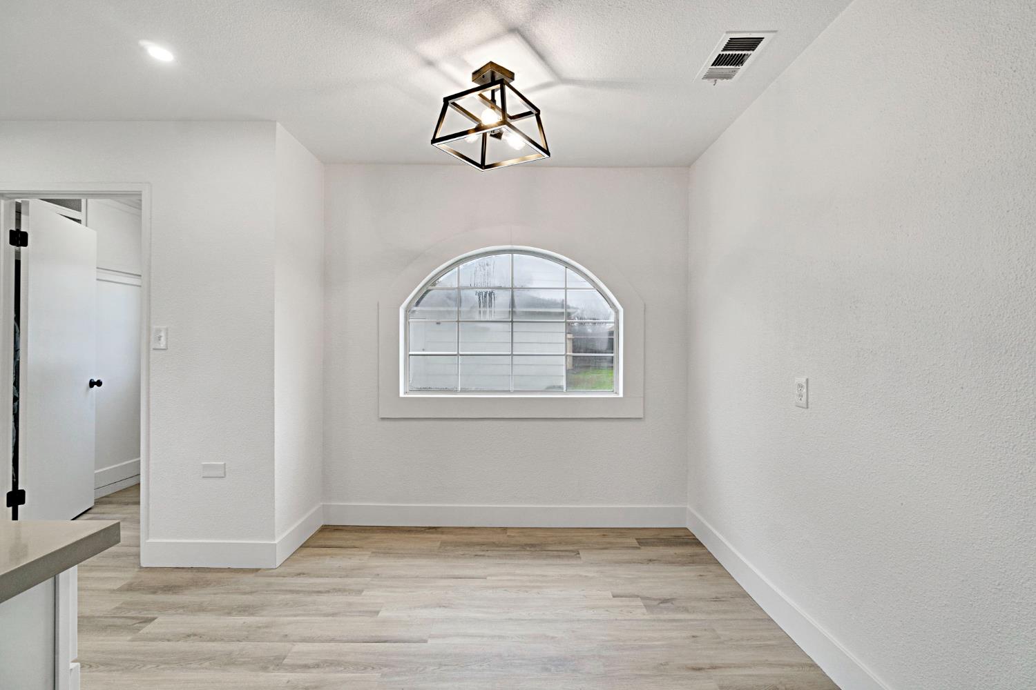 1503 North Pacific Avenue Fresno, CA 93728 - Photo 8 of 26 a view of an entryway with wooden floor