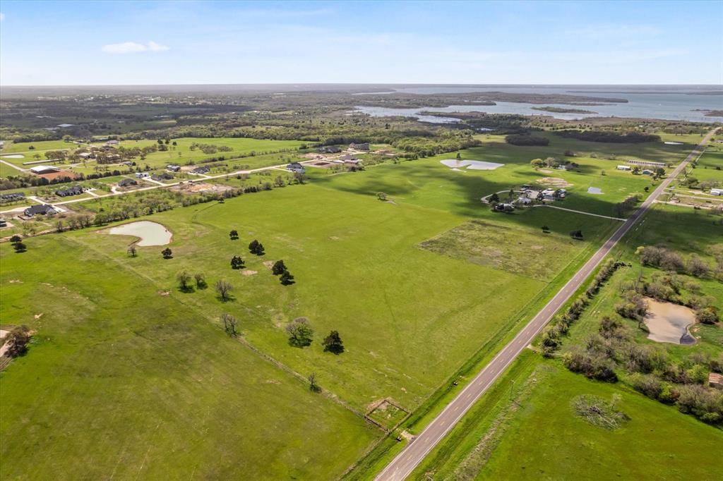 Tbd West Walcott Street Pilot Point, TX 76258 - Photo 2 of 3 a view of an ocean from a balcony