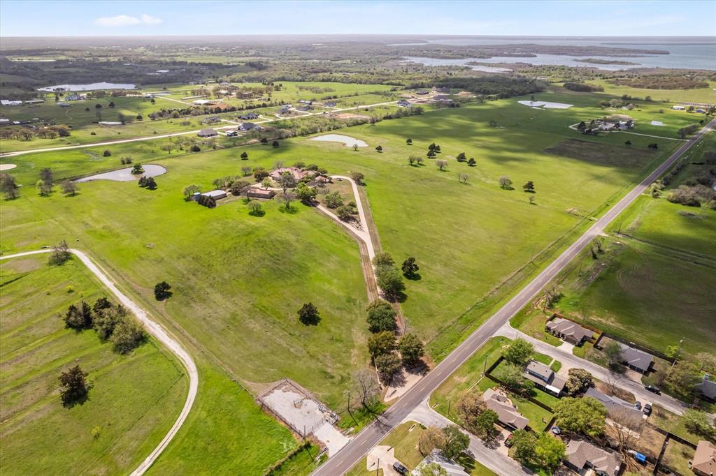 Tbd West Walcott Street Pilot Point, TX 76258 - Photo 3 of 3 an aerial view of residential houses with outdoor space