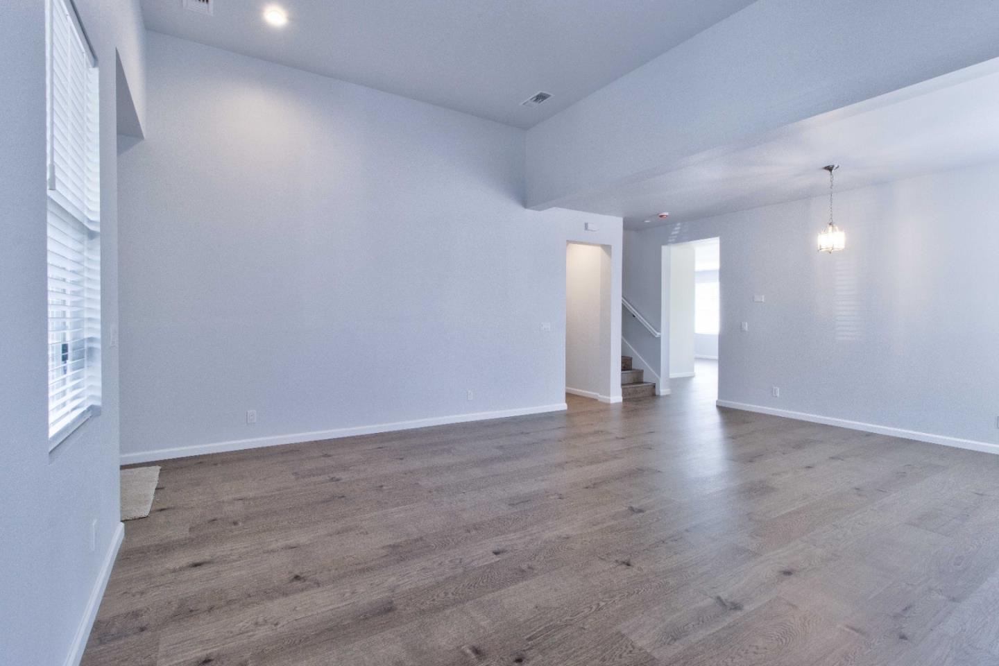 2715 Shellgate Circle Hayward, CA 94545 - Photo 5 of 47 a view of an empty room with wooden floor and a window