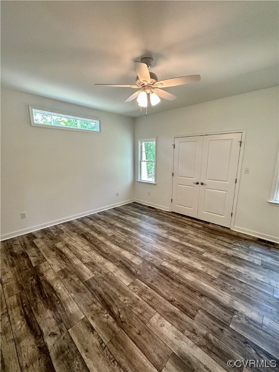 13284 Hanover Courthouse Road Hanover, VA 23069 - Photo 9 of 18 an empty room with wooden floor fan and windows
