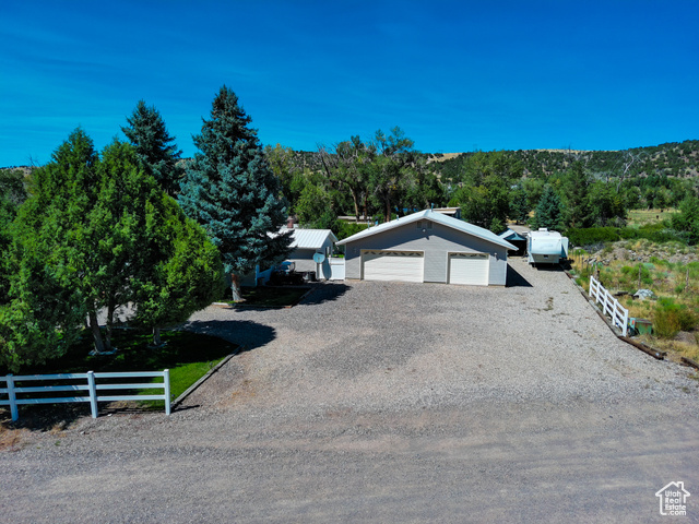 2373 East 190 North Beaver, UT 84713 - Photo 2 of 54 View of front of house with an outbuilding and gravel driveway