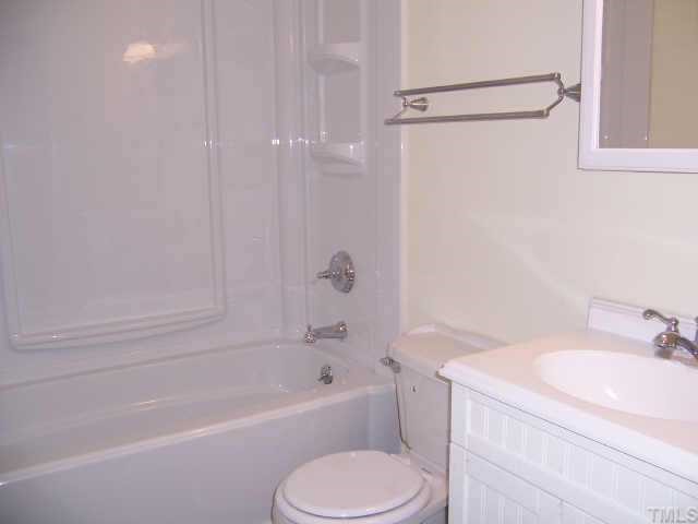 4161 Virgilina Road Roxboro, NC 27574 - Photo 12 of 12 Hall Bath is full bath with nice new tub, toilet, sink and vanity