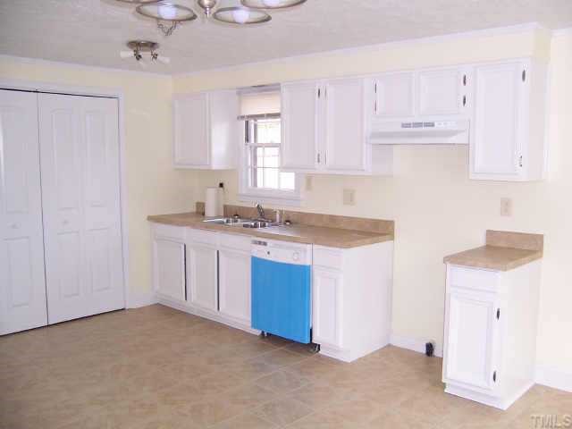 4161 Virgilina Road Roxboro, NC 27574 - Photo 3 of 12 Kitchen/Dining combo has inlaid tile floor,new light fixtures,freshly painted