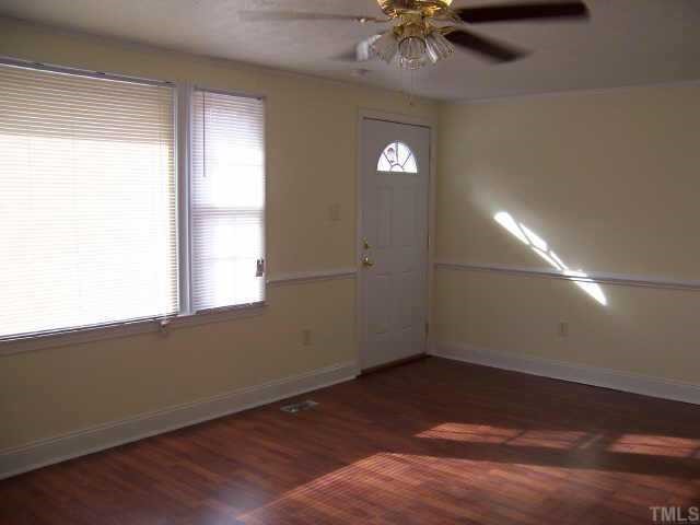 4161 Virgilina Road Roxboro, NC 27574 - Photo 4 of 12 Living area has opening to Kitchen/Dining,Chair rail,