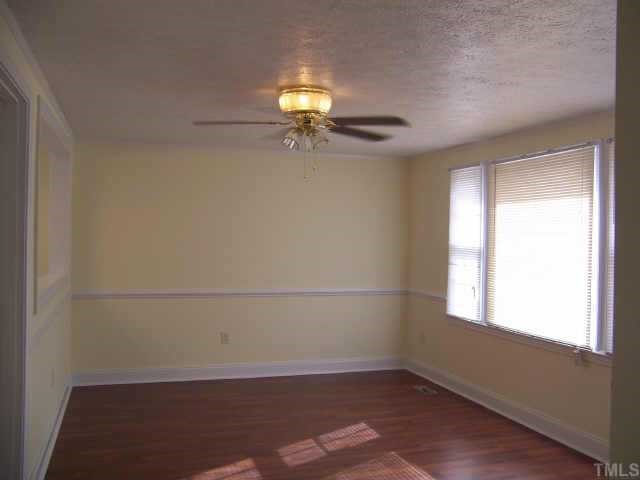 4161 Virgilina Road Roxboro, NC 27574 - Photo 5 of 12 New laminate floor, light fixtures too.