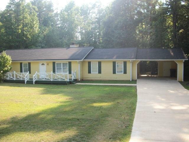 110 Roberts Road Covington, GA 30016 - Photo 1 of 1 a house with swimming pool in front of it