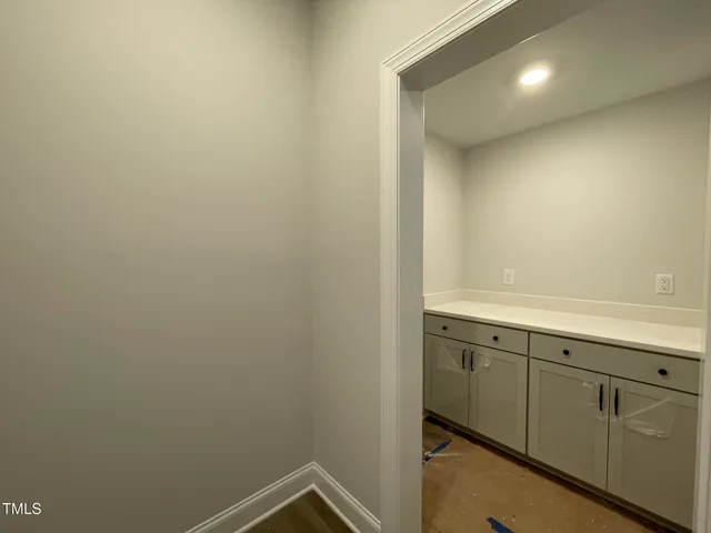a bathroom with a sink and mirror