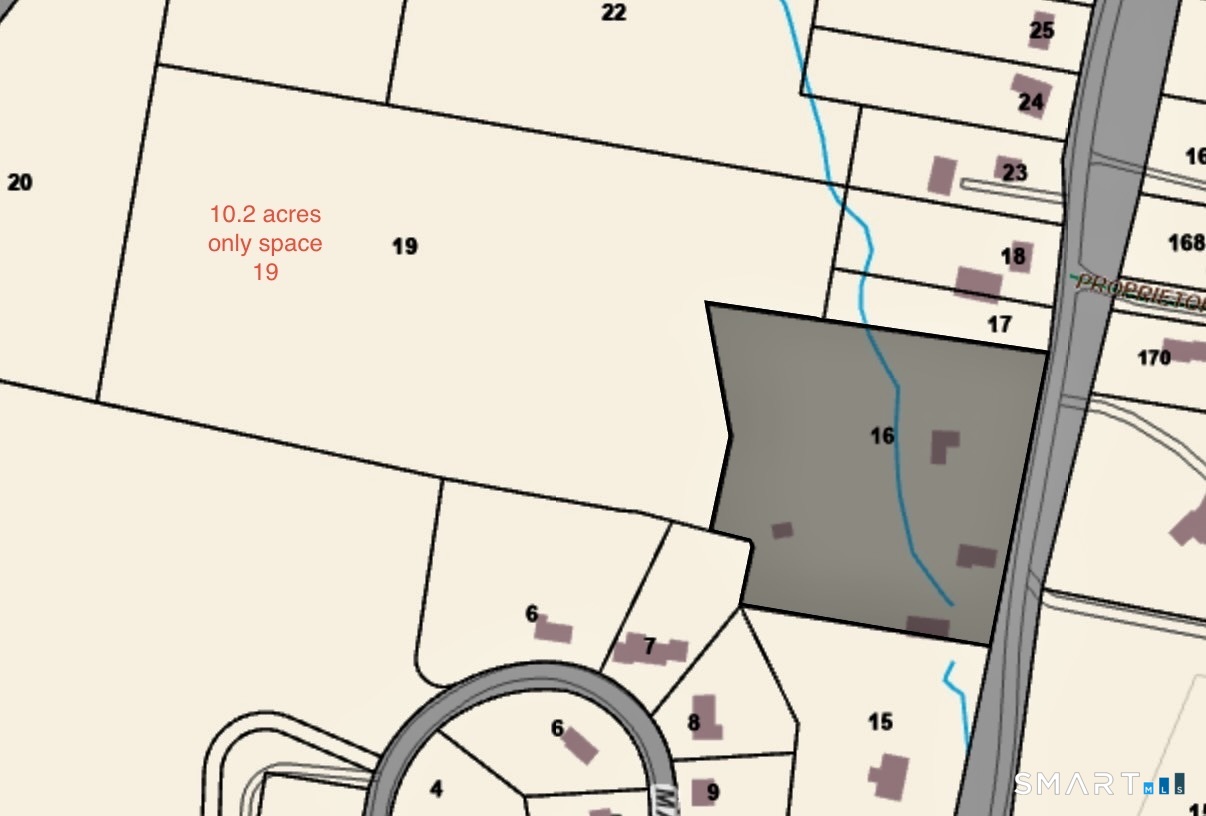 a white house with a sink and wooden floor