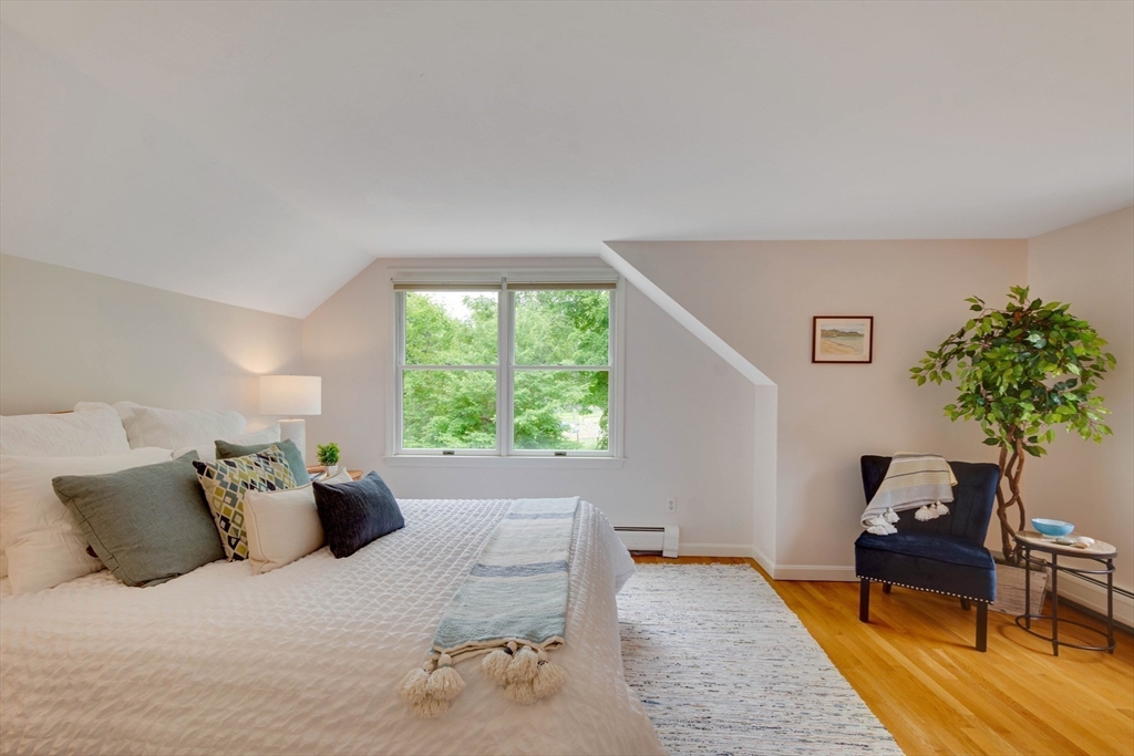 33 Farrar Road Lincoln, MA 01773 - Photo 16 of 31 a bed room with a bed and a couch