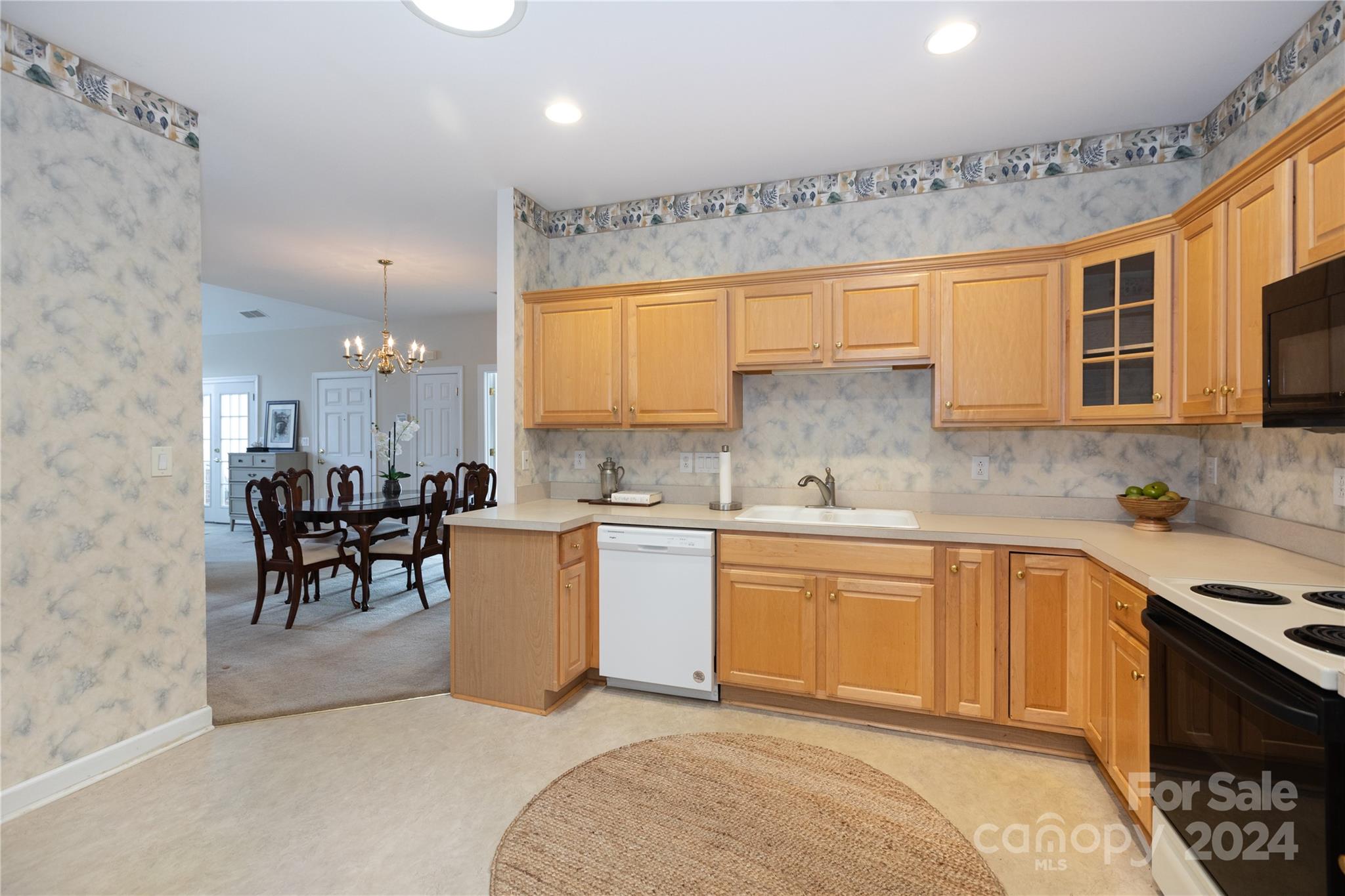 8368 Windsor Ridge Drive Charlotte, NC 28277 - Photo 12 of 28 a kitchen with a sink cabinets and window