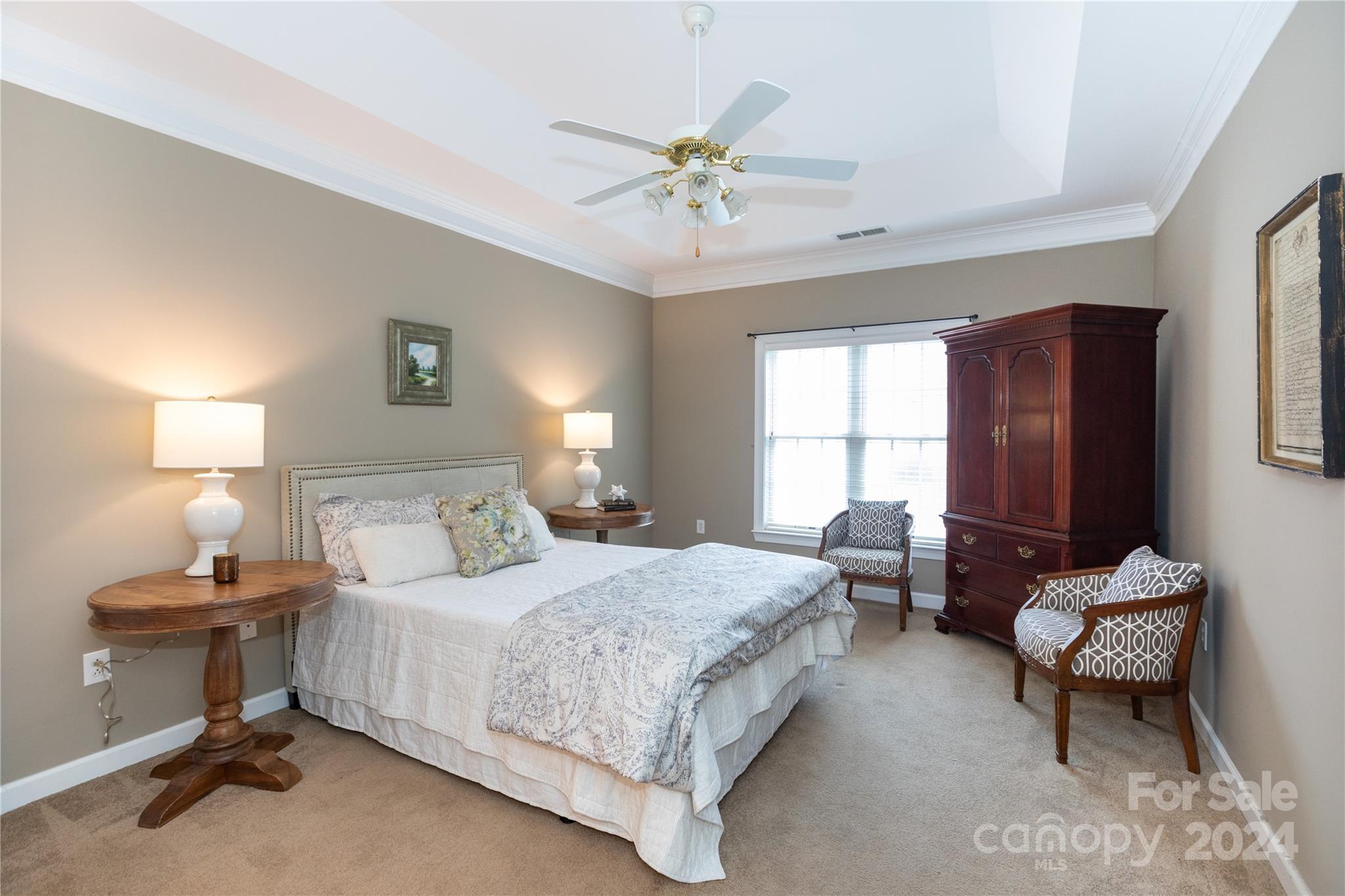 8368 Windsor Ridge Drive Charlotte, NC 28277 - Photo 15 of 28 a bedroom with a bed and a chandelier
