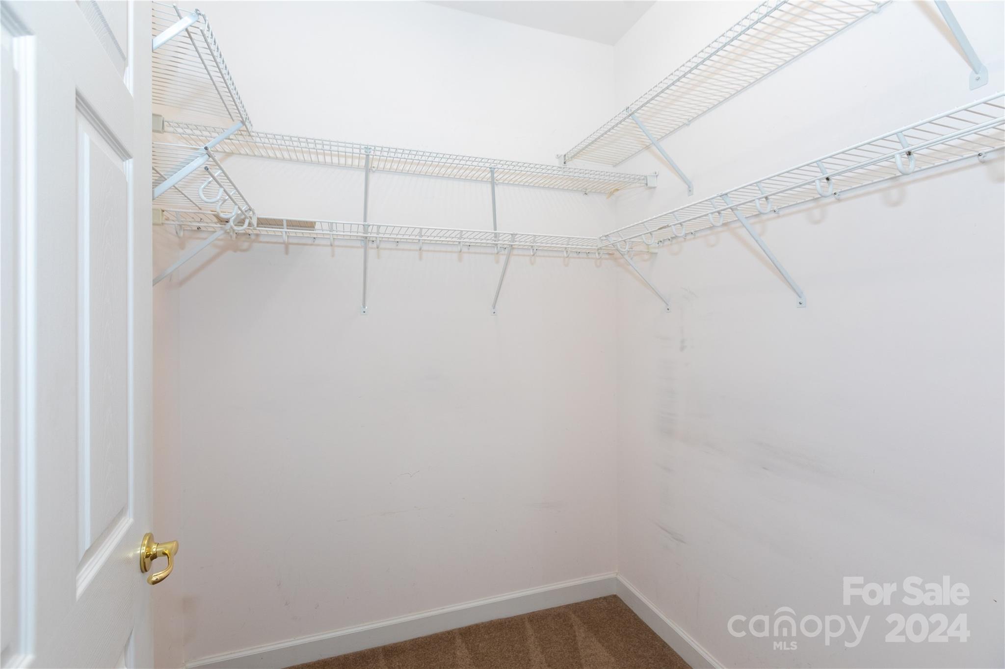8368 Windsor Ridge Drive Charlotte, NC 28277 - Photo 19 of 28 a view of a room with racks on the wall