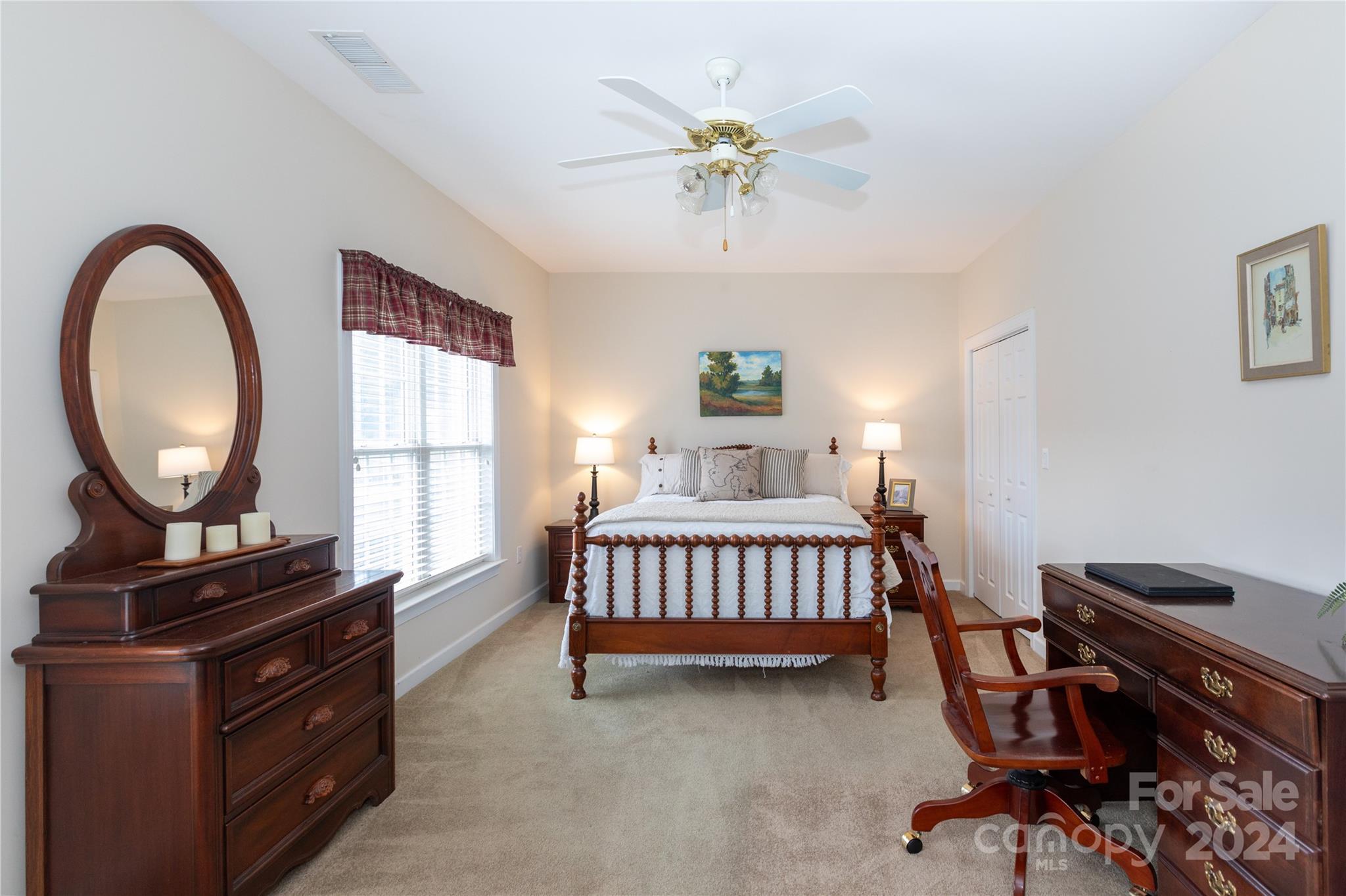 8368 Windsor Ridge Drive Charlotte, NC 28277 - Photo 20 of 28 a bedroom with a bed and a chandelier
