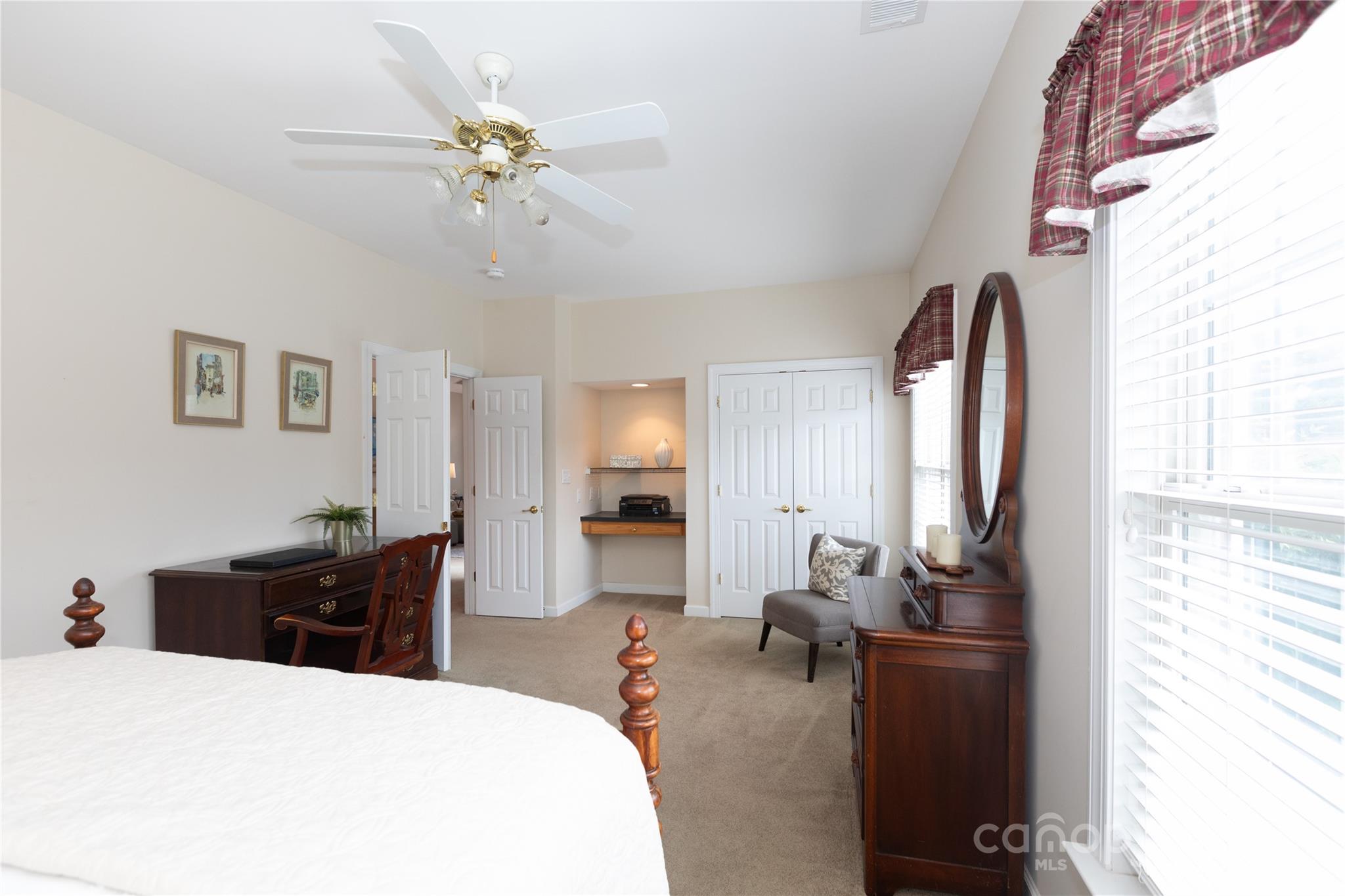 8368 Windsor Ridge Drive Charlotte, NC 28277 - Photo 21 of 28 a living room with furniture a chandelier and a window