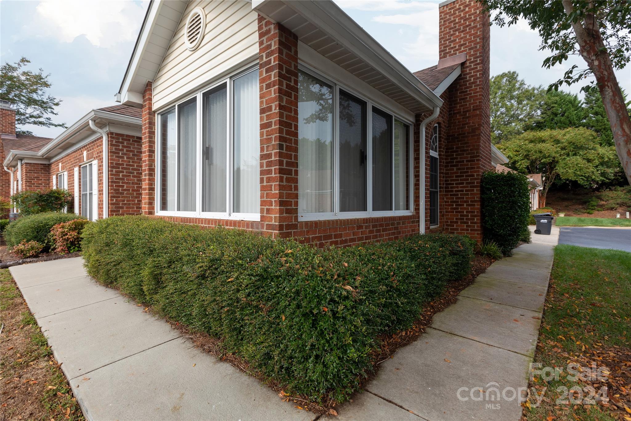 8368 Windsor Ridge Drive Charlotte, NC 28277 - Photo 25 of 28 a front view of a house with garden