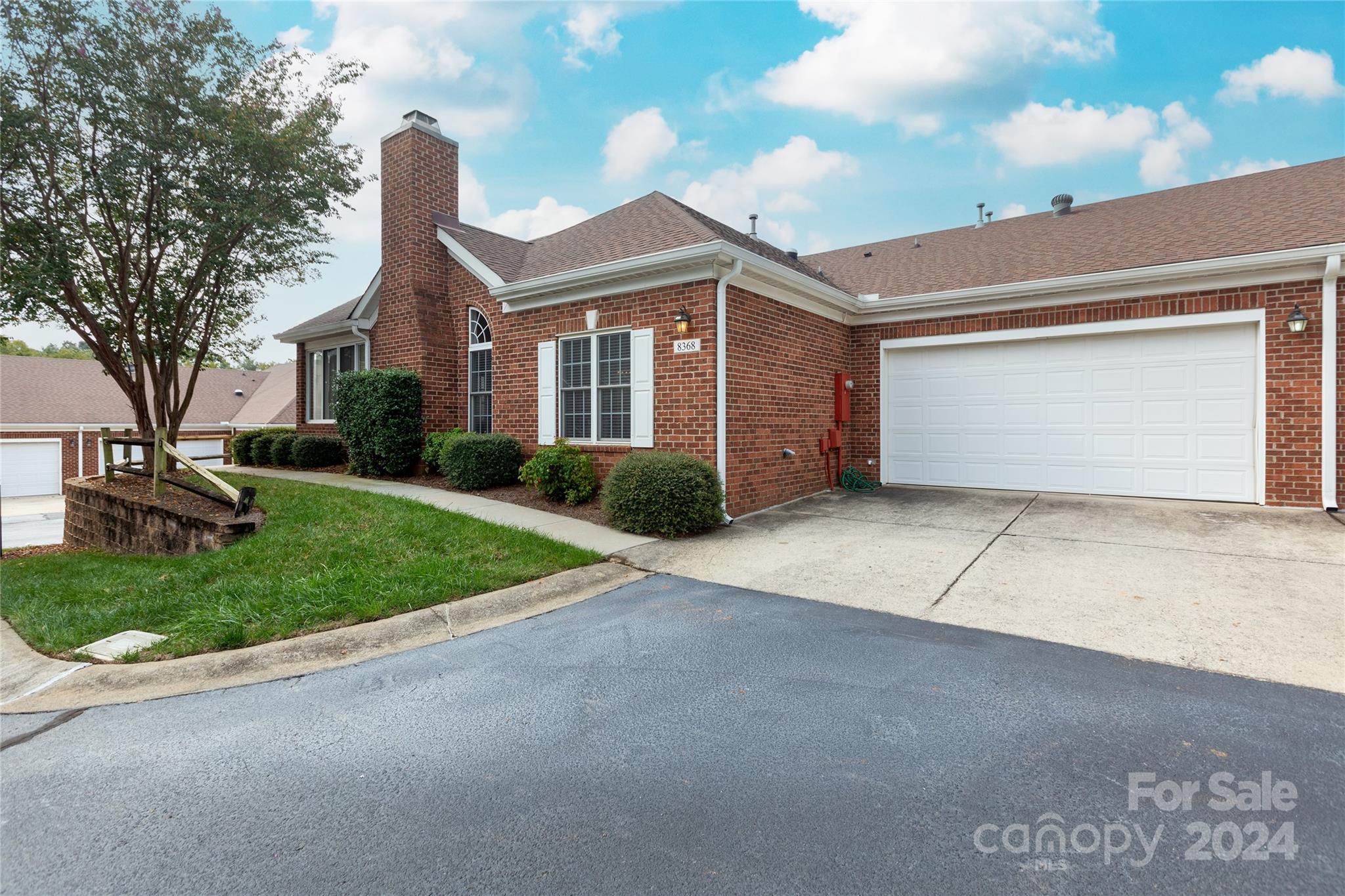 8368 Windsor Ridge Drive Charlotte, NC 28277 - Photo 26 of 28 a front view of a house with a yard and garage
